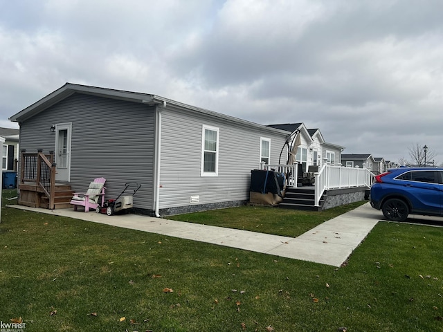 view of front facade featuring a front lawn and a deck