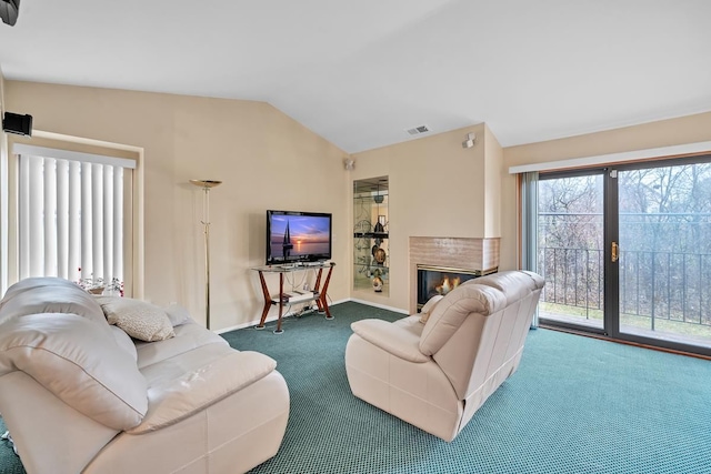 carpeted living room featuring vaulted ceiling