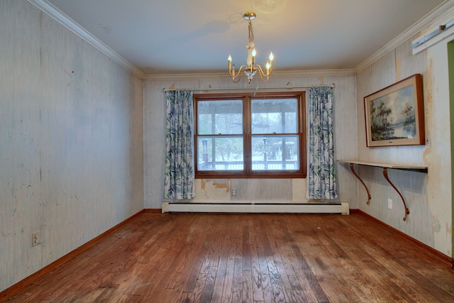 unfurnished dining area featuring hardwood / wood-style flooring, a baseboard heating unit, ornamental molding, and an inviting chandelier