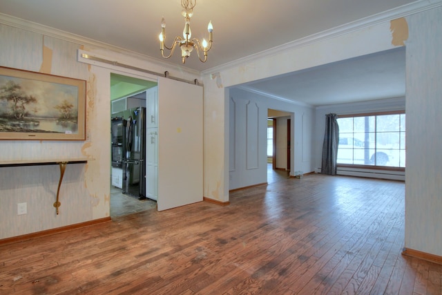 unfurnished room with a chandelier, hardwood / wood-style floors, a baseboard radiator, and crown molding