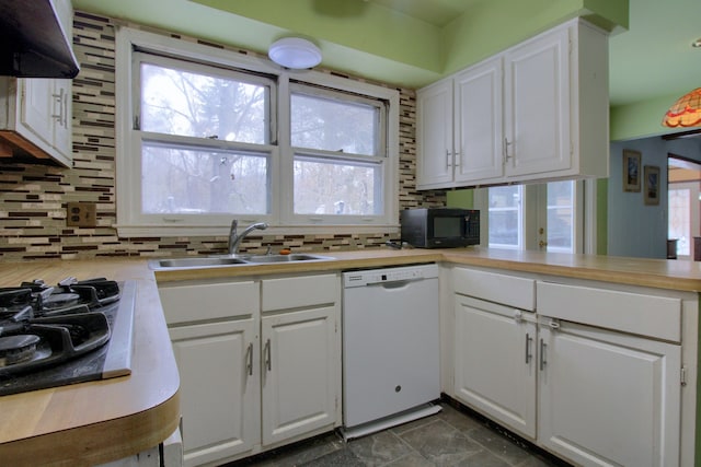 kitchen with sink, white cabinetry, and black appliances