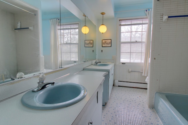 bathroom featuring vanity, a baseboard heating unit, shower / bathtub combination with curtain, tile walls, and tile patterned flooring