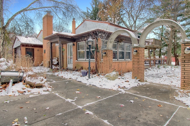 view of snow covered house