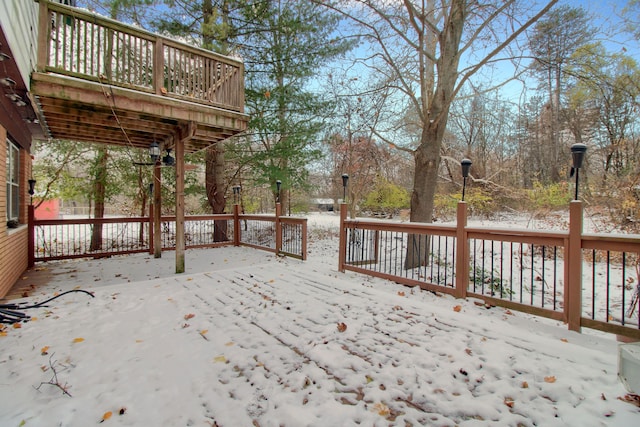 view of snow covered deck