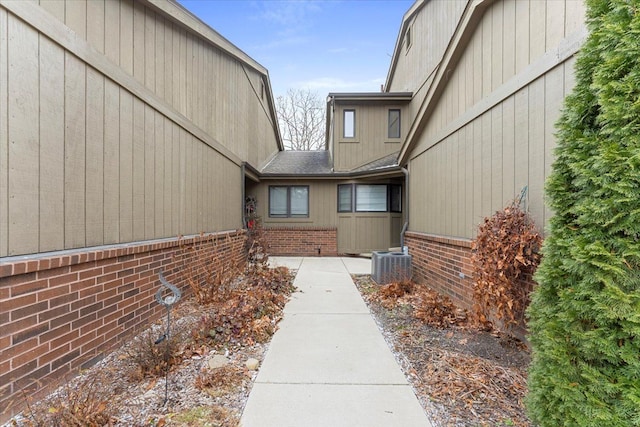 property entrance featuring central AC unit