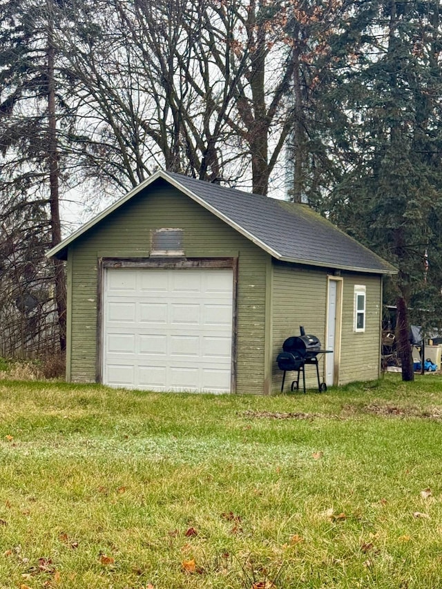 garage featuring a yard