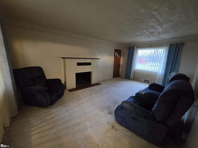 living room with carpet flooring and a textured ceiling