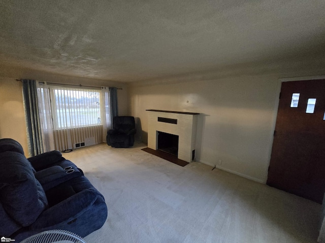 living room featuring light carpet and a textured ceiling