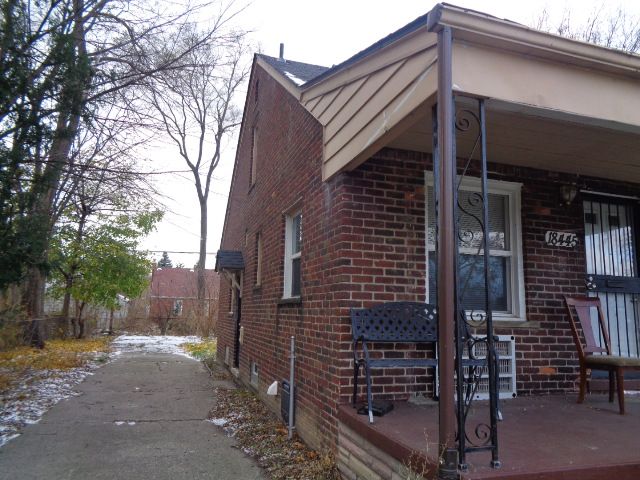 view of property exterior with covered porch