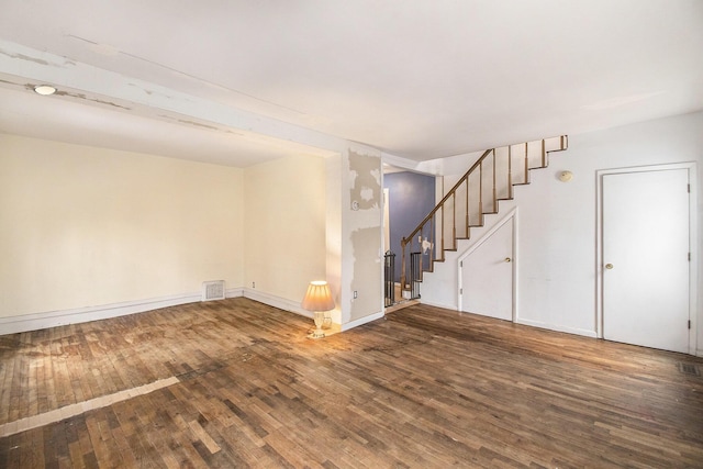 unfurnished room with hardwood / wood-style flooring