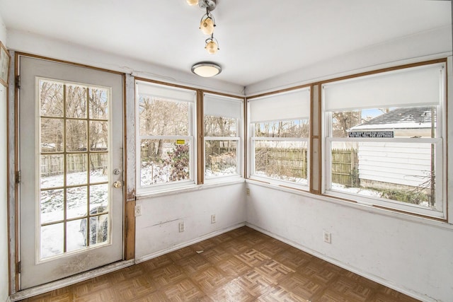 unfurnished sunroom with a healthy amount of sunlight