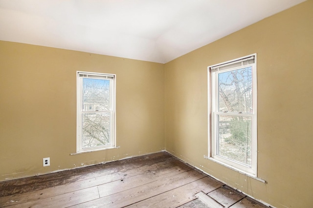 unfurnished room with light wood-type flooring and a healthy amount of sunlight