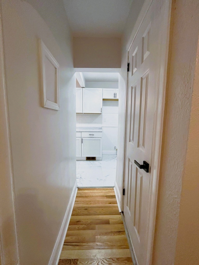 corridor featuring light hardwood / wood-style floors