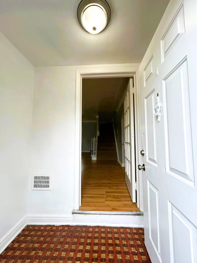 hallway featuring dark hardwood / wood-style floors