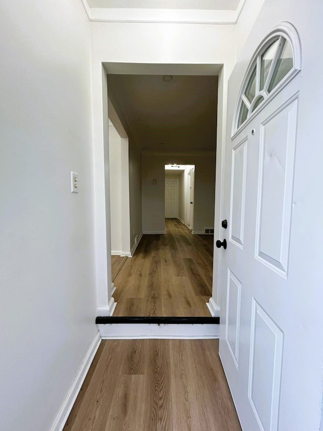 corridor with wood-type flooring