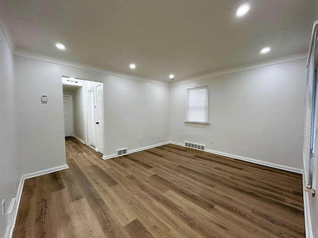 empty room with wood-type flooring