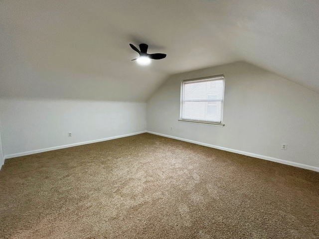 bonus room with carpet floors, vaulted ceiling, and ceiling fan