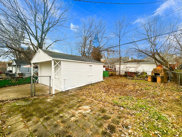 view of side of property with an outbuilding