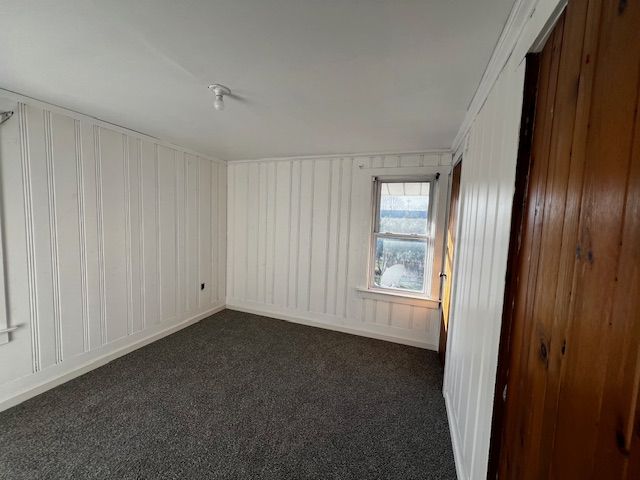 carpeted spare room with ornamental molding