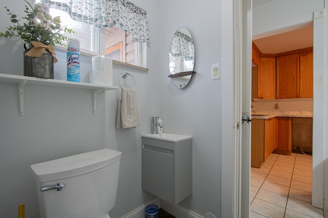 bathroom featuring tile patterned floors, backsplash, vanity, and toilet