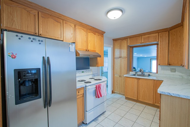 kitchen featuring decorative backsplash, stainless steel fridge, sink, electric range, and light tile patterned flooring