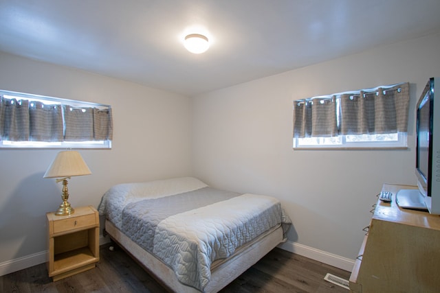 bedroom featuring dark hardwood / wood-style floors