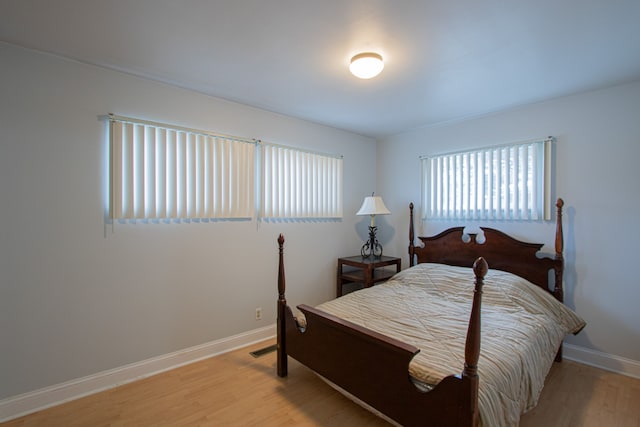 bedroom with light hardwood / wood-style flooring