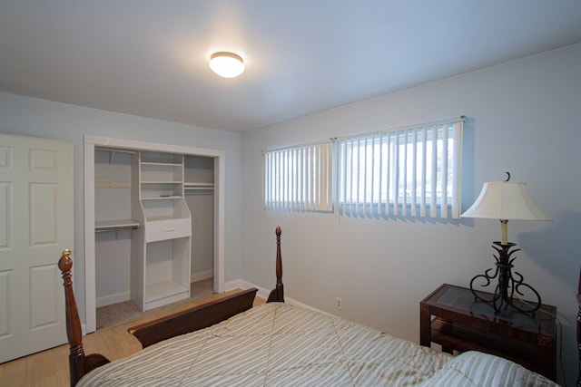 bedroom featuring wood-type flooring and a closet