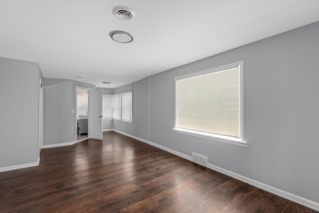 unfurnished living room featuring dark wood-type flooring