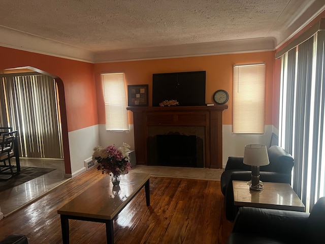 living room featuring dark hardwood / wood-style floors and a textured ceiling