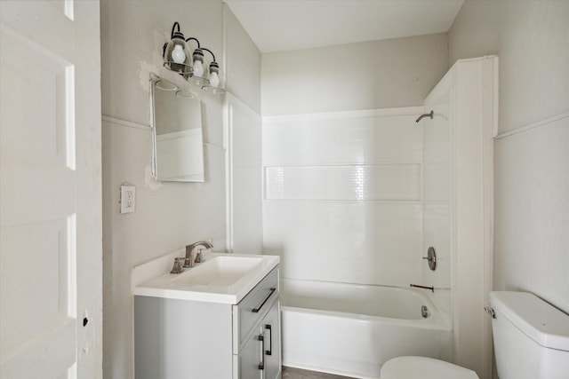 full bathroom featuring vanity, bathtub / shower combination, and toilet