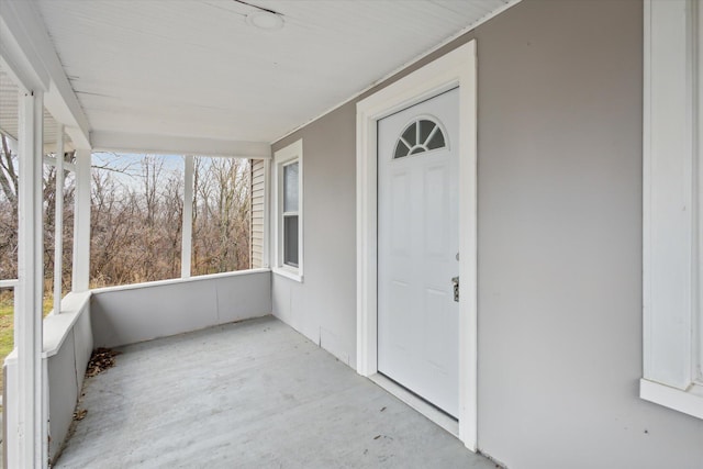 entrance to property featuring covered porch