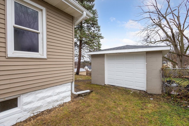 view of home's exterior featuring a yard and an outbuilding