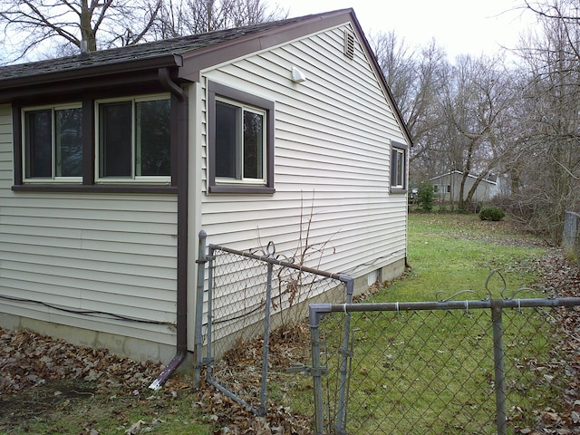 view of property exterior with a yard