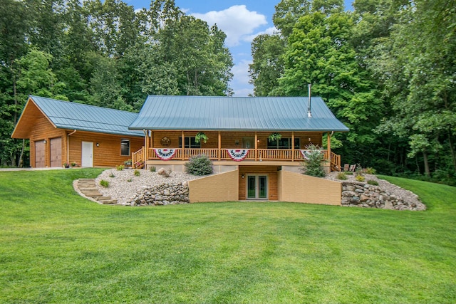 rear view of property with a lawn