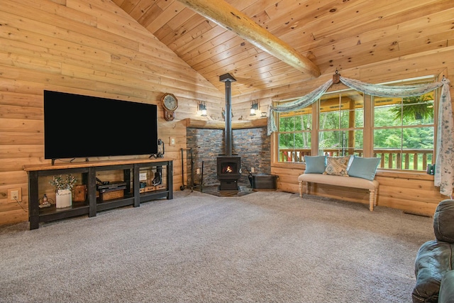 unfurnished living room with beam ceiling, a wood stove, wooden ceiling, high vaulted ceiling, and carpet floors