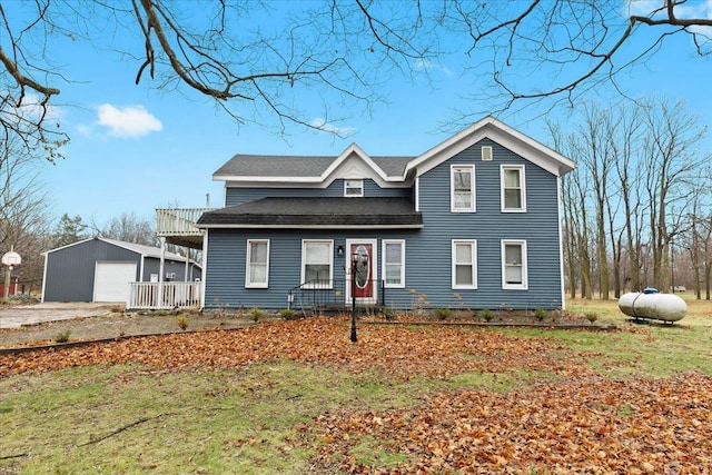 view of front property with a garage and an outdoor structure