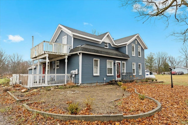 view of side of home with a porch