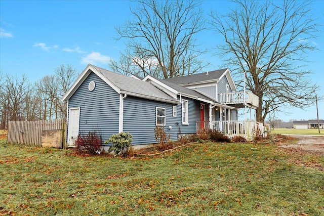 view of property exterior with a yard