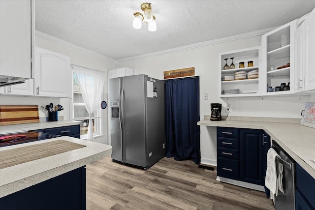 kitchen featuring stainless steel appliances, blue cabinets, crown molding, white cabinets, and light wood-type flooring