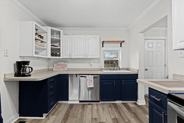 kitchen featuring blue cabinetry, white cabinets, light hardwood / wood-style floors, and appliances with stainless steel finishes