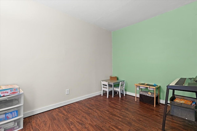 recreation room with dark hardwood / wood-style floors