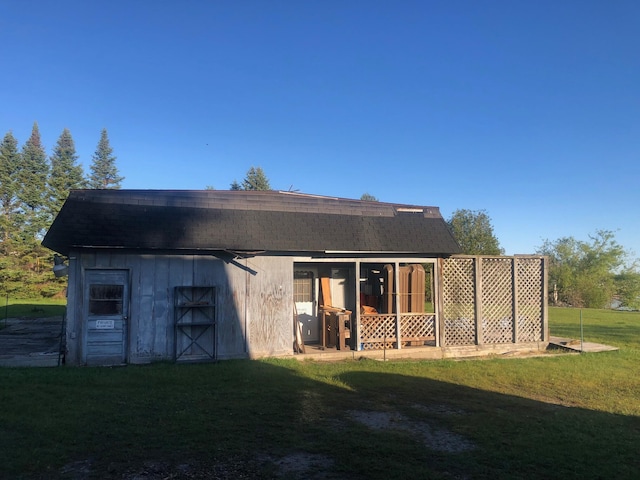 rear view of house with a lawn