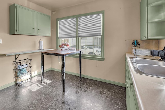 kitchen featuring sink and green cabinetry