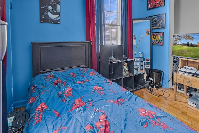 bedroom featuring wood-type flooring