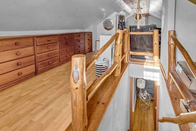 interior space with wood-type flooring and vaulted ceiling