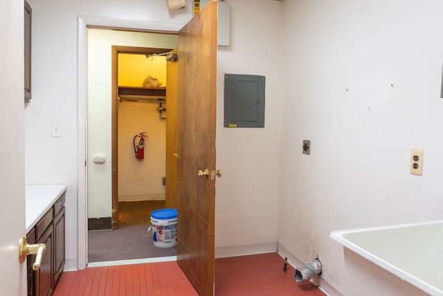 laundry area with electric dryer hookup, carpet floors, and electric panel