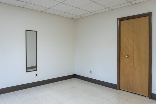 empty room with a paneled ceiling