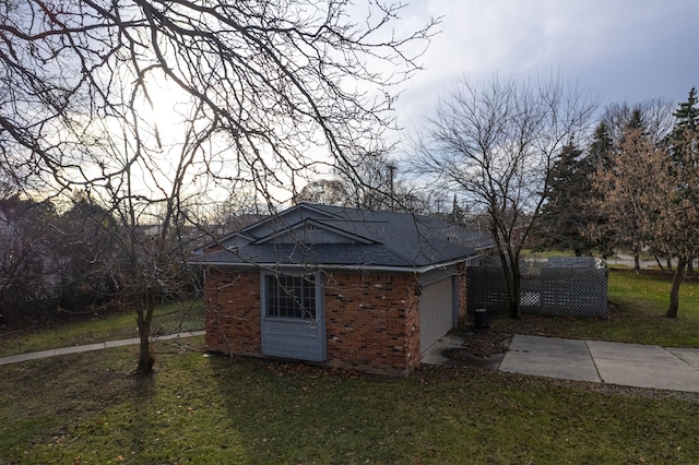 view of outdoor structure featuring a lawn