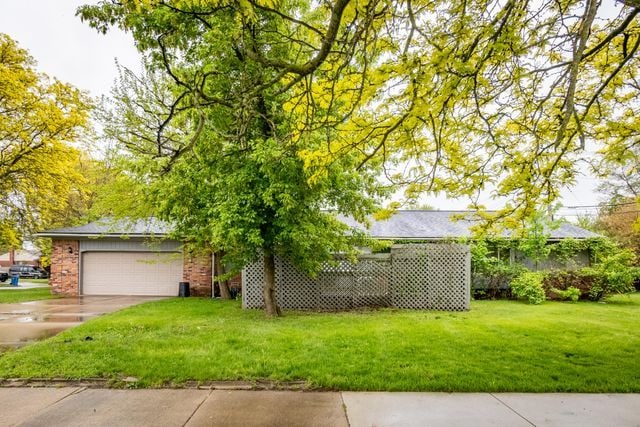 5620 Kaufman St, Dearborn Heights, MI 48125 - view of green lawn with driveway